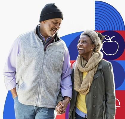 A man and woman hold hands while walking.