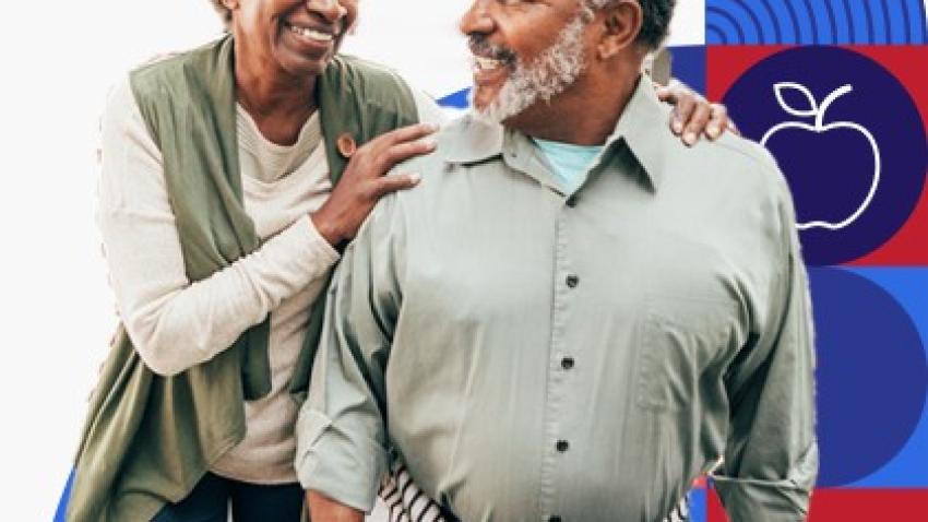 An older man and woman hug.