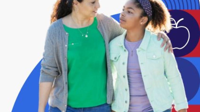 A mom walks with her arm around her daughter’s shoulders while they talk.